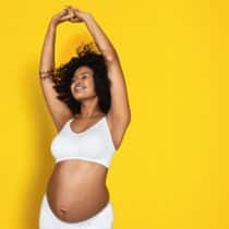 keep-cool-ultra-maternity-nursing-bra-bruk-white-arms-raised-on-yellow-background